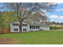 A charming home with a well-maintained lawn and mature trees, offering curb appeal at 1531 Piedmont Ne Rd, Marietta, GA 30066