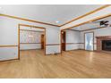 Spacious living room with wood-look floors, a ceiling fan, and an adjoining dining area at 2003 Graystone Pkwy, Grayson, GA 30017