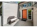 Inviting front porch with a bench provides a warm welcome to this lovely home at 8885 N Mount Dr, Johns Creek, GA 30022