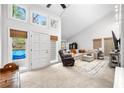 Spacious living room features high ceilings, large windows, and neutral decor at 8885 N Mount Dr, Johns Creek, GA 30022