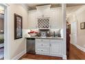 Stylish wine rack area featuring modern appliances and granite countertops at 115 Batten Board Way Way, Woodstock, GA 30189