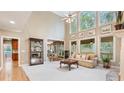 Spacious living room with fireplace, hardwood floors, large windows, and an open floor plan perfect for entertaining at 104 Kremer Falls Trce, Canton, GA 30114