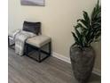 Entryway with a decorative bench, plant, and gray floors at 2991 Greyhawk Ln, Cumming, GA 30040