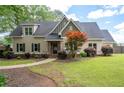 Inviting home exhibits a neatly landscaped yard and charming exterior details at 2356 Pinkney Dr, Marietta, GA 30062