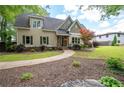 Attractive home features a welcoming walkway leading to a charming covered entryway and well-kept lawn at 2356 Pinkney Dr, Marietta, GA 30062
