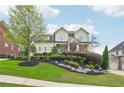 Inviting front exterior with professional landscaping and lush green lawn at 1401 Kings Park Nw Dr, Kennesaw, GA 30152