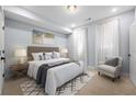 Cozy bedroom showcasing a comfortable bed, neutral decor, and stylish furnishings at 1048 Claudette Colvin Ct, Atlanta, GA 30318
