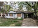 Compact, one level home with white brick and attached carport at 1809 San Gabriel Ave, Decatur, GA 30032