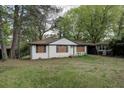 Cozy, single story house with white brick and attached carport at 1809 San Gabriel Ave, Decatur, GA 30032