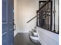 Entryway of a home featuring hardwood floors and staircase with decorative iron railing at 2767 Durham Ne Dr, Atlanta, GA 30319