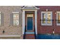 Close up of the front door and entrance of a brick townhome with garage at 2767 Durham Ne Dr, Atlanta, GA 30319