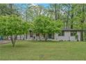 Well-maintained exterior of a ranch-style home with mature trees and a spacious front yard at 3658 Brock Rd, Duluth, GA 30096