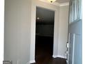 A view from the entryway to a dining room that displays the wood flooring at 3908 Shelleydale Dr, Powder Springs, GA 30127