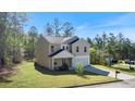 Beautiful two-story home with a two-car garage and manicured lawn at 15 Sloane Ct, Covington, GA 30016