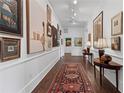 Hallway gallery showcasing hardwood floors, an oriental rug, and decorative artwork at 3101 Howell Mill Nw Rd # 301, Atlanta, GA 30327