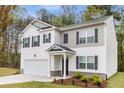 Charming two-story home featuring a white exterior, black shutters, and an attached two-car garage at 3736 Chevington Se Ct, Atlanta, GA 30354