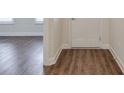 Inviting foyer showcasing elegant wood flooring and crisp white trim at 807 Bridget Sw Walk, Powder Springs, GA 30127