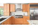 Modern kitchen featuring stainless steel appliances, granite countertops, and stylish wood cabinetry at 2685 Hearthstone Cir, Marietta, GA 30062