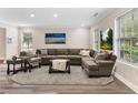 Spacious living room with modern furniture, large windows, and a neutral color palette at 1125 Reunion Pl, Atlanta, GA 30331
