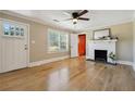 Bright living room with hardwood floors, fireplace, and natural light at 785 Alice St, Forest Park, GA 30297