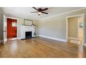 Inviting living room featuring hardwood floors and a decorative fireplace at 785 Alice St, Forest Park, GA 30297