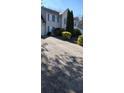 Long driveway leading up to a two-story house with green landscaping at 3247 Sugar Creek Se Trce, Atlanta, GA 30316