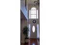 Grand two-story foyer featuring a decorative window, clock, and tiled floor at 3247 Sugar Creek Se Trce, Atlanta, GA 30316