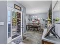 Elegant dining room with stylish decor, featuring a wooden table, seating for six, and ample natural light at 5462 S Crest Ridge S Dr, Ellenwood, GA 30294