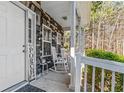 Charming front porch featuring rocking chairs and stylish decor, perfect for relaxing and enjoying the outdoors at 5462 S Crest Ridge S Dr, Ellenwood, GA 30294