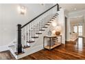 Beautiful staircase and hardwood floors provide a warm and inviting entrance at 156 Lake Forrest Ne Ln, Atlanta, GA 30342