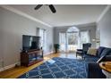 Open living room with hardwood flooring, plenty of natural light, and stylish furnishings at 9600 Poplar Ct, Douglasville, GA 30135