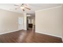 Open living room featuring hardwood floors and a doorway view to the kitchen at 3459 Village Park Sw Ln, Atlanta, GA 30331