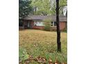 Cozy one-story brick house featuring a covered porch and a well-maintained lawn with mature trees at 2667 Plantation Dr, Atlanta, GA 30344