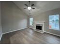 This living room features vaulted ceilings, a modern fireplace and lots of natural light at 5961 Sherwood Trce, Stonecrest, GA 30038