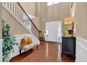 Inviting foyer with soaring ceilings, hardwood floors, and staircase at 2384 Allsborough Way, Dacula, GA 30019