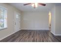 Bright living room showcasing modern flooring and a window allowing natural light at 2038 Thomasville Se Dr, Atlanta, GA 30315