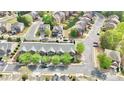 Aerial view of a well-maintained neighborhood with townhomes and mature trees at 3546 Flycatcher Way, Duluth, GA 30097