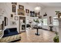 Spacious living room featuring an array of art, hardwood floors, and a grand staircase at 703 Cumberland Ne Cir, Atlanta, GA 30306