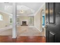Spacious living room showcasing a tray ceiling, a fireplace, and an open floor plan at 206 Towler Dr, Loganville, GA 30052