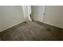 Bedroom featuring wall-to-wall carpeting and basic features with two doors at 6344 Fitzgerald Ln, Austell, GA 30168