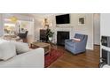 Cozy living room with fireplace, hardwood floors, and an open view to other living areas at 200 Heaton Park Dr, Decatur, GA 30030