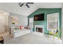 Inviting living room with fireplace, vaulted ceiling, and bright natural light at 2016 River Heights Se Walk, Marietta, GA 30067