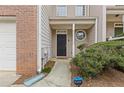 Inviting front porch and walkway enhance this townhome's curb appeal with fresh landscaping at 331 Parkview Manor Dr, Tucker, GA 30084