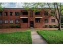 Classic brick apartment building with green lawn and mature trees at 1380 Chalmette Ne Dr # 3, Atlanta, GA 30306