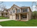 Well-maintained two-story home with a lush green lawn and a two-car garage at 3892 Trillium Wood Trl, Snellville, GA 30039