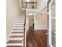 Elegant entryway with hardwood floors, staircase, and views of the living room at 3892 Trillium Wood Trl, Snellville, GA 30039