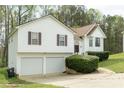 Charming two-story home with a two-car garage and well-maintained landscaping at 169 Concorde Dr, Villa Rica, GA 30180