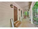 Inviting front porch with seating area and a warm, welcoming entrance at 4336 Yancey Rd, Douglasville, GA 30135