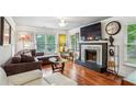 The living room features a fireplace, hardwood floors, and natural light at 1899 Cooper Landing Se Dr, Smyrna, GA 30080