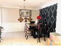 Dining room showcasing elegant decor, decorative accents, and tile flooring at 2896 Spence Ct, Dacula, GA 30019